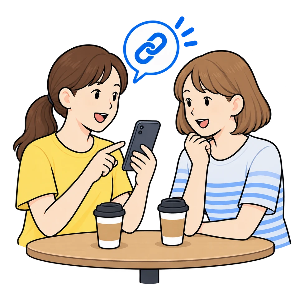 カフェで友人に紹介リンクを見せる場面